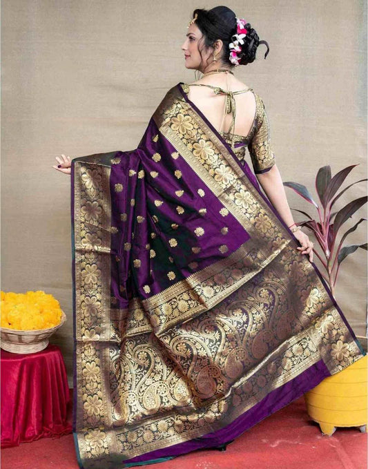 Woman wearing a purple and gold saree with a floral background